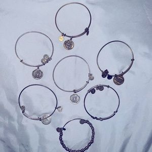 7 Authentic Alex & Ani bracelets.